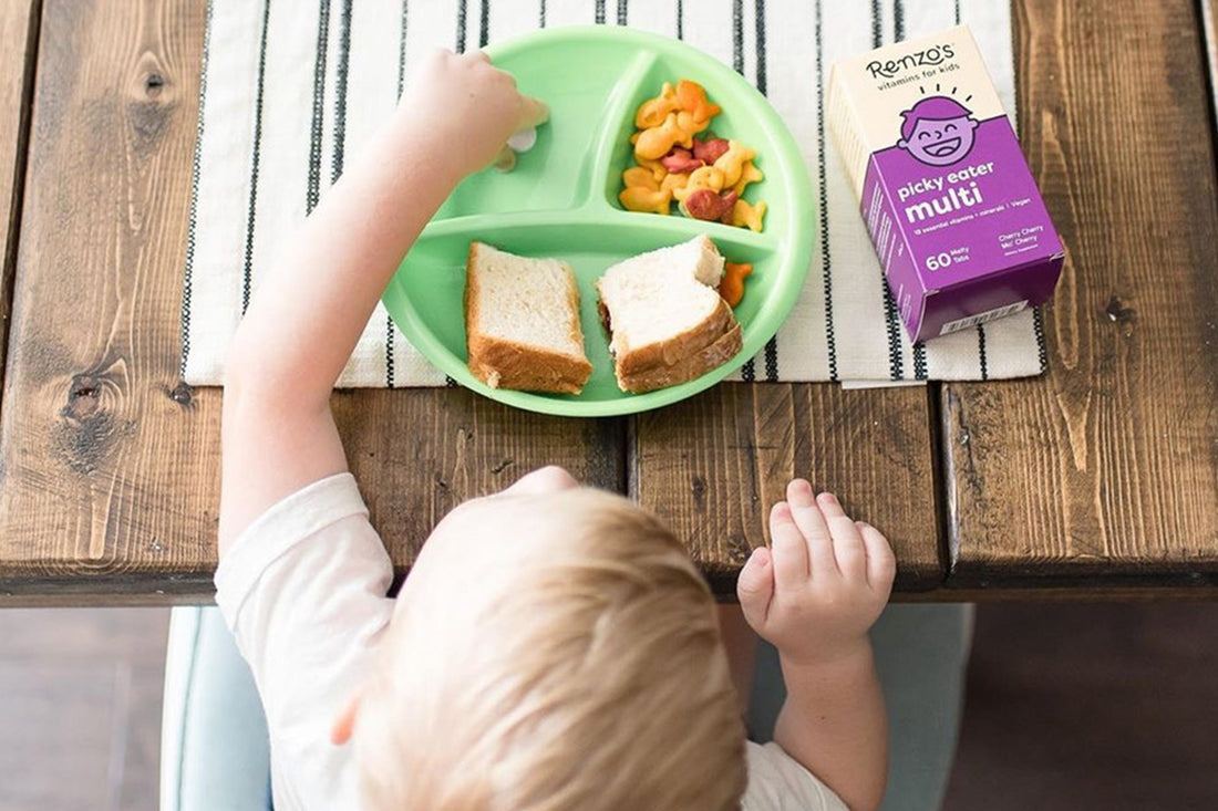 kid eats breakfast with renzos multivitamin