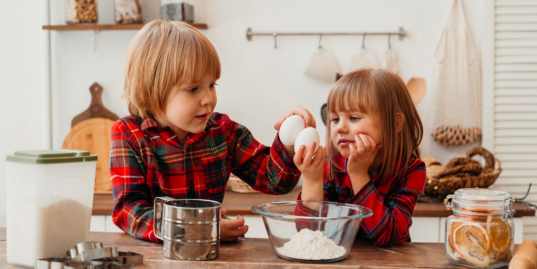 2 kids following a recipe and making food. Discover 5 easy and nutritious Vitamin D recipes for kids, including salmon, mushrooms, eggs, yogurt, and tuna melt!