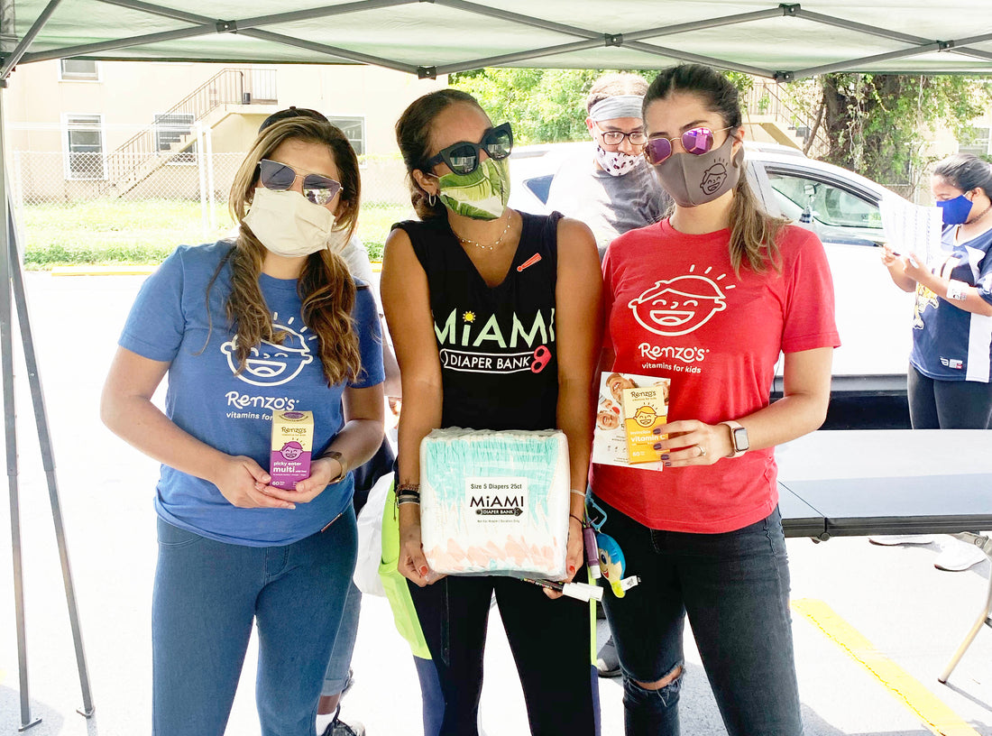 3 girls donating renzos vitamins at miami diaper bank