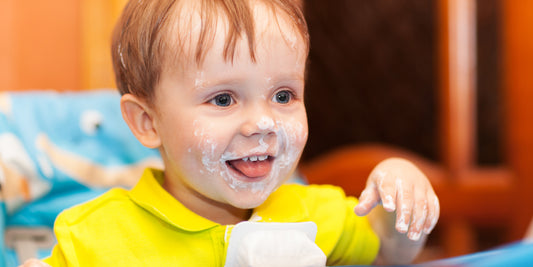 Kid enjoying a glass of calcium-rich milk. Find out why calcium for kids is so important and how to ensure they get enough with supplements or a calcium-rich diet.