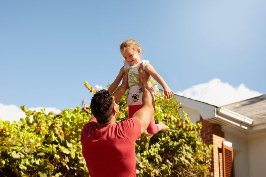 baby girl playing with daddy