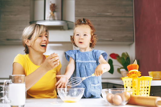 mom and her baby girl at the kitchen