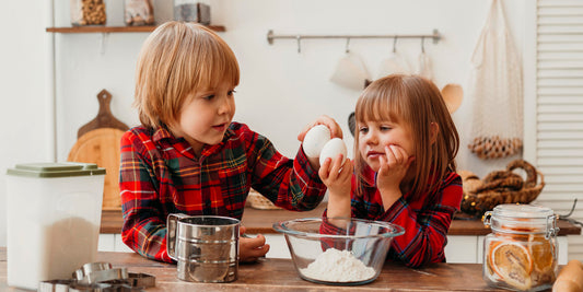 2 kids following a recipe and making food. Discover 5 easy and nutritious Vitamin D recipes for kids, including salmon, mushrooms, eggs, yogurt, and tuna melt! 